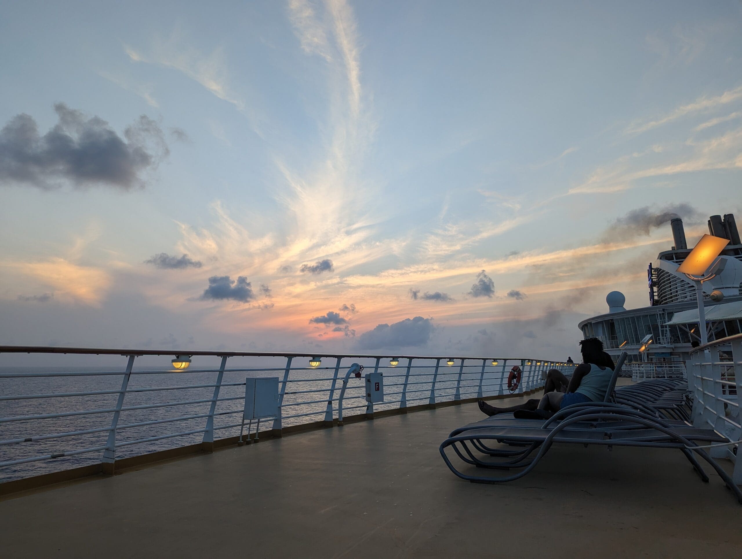 A sunset viewed from the top deck of a cruise ship.