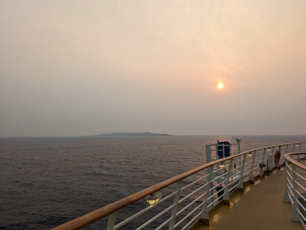 A sunset from the top deck of a ship.