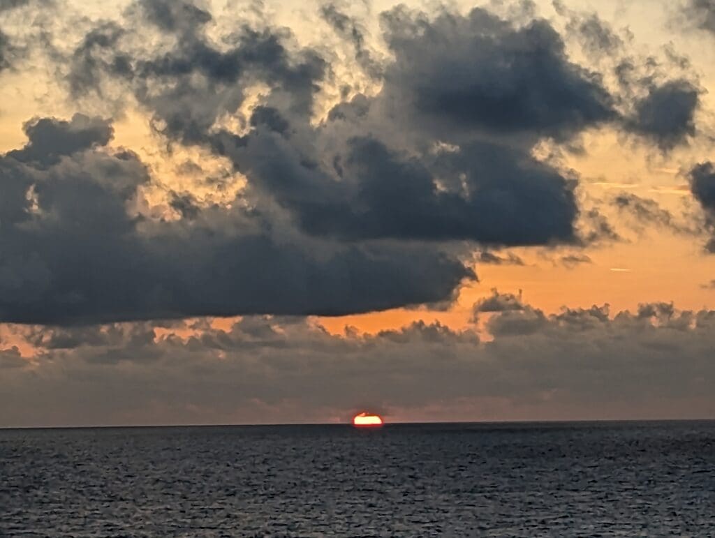 The sun setting into the sea.