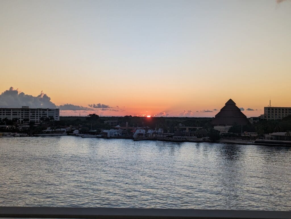 The sun setting over a Caribbean town.