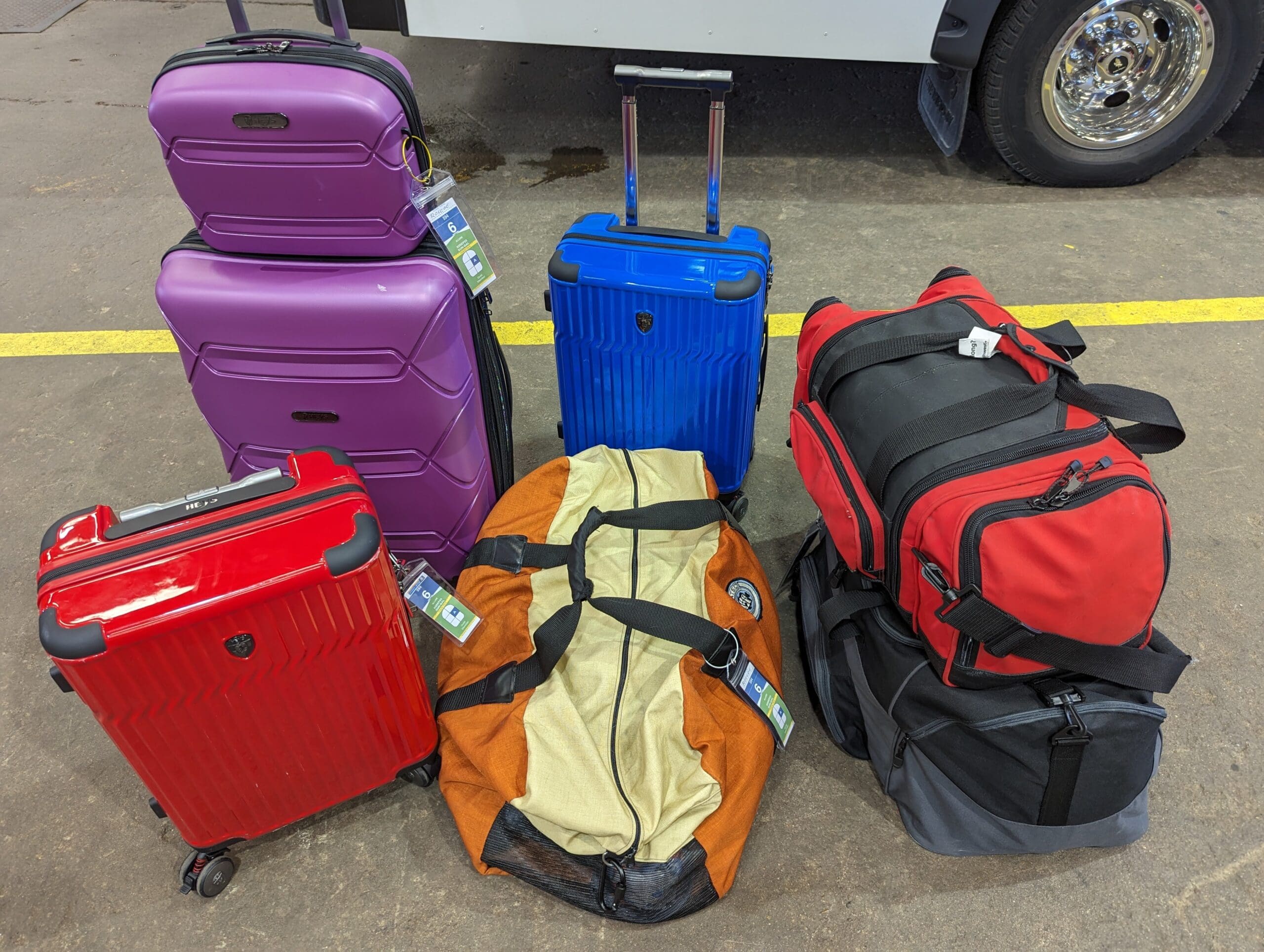 luggage stacked near a vehicle